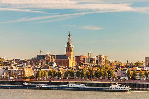 The Dutch city of Nijmegen during sunset with the river Waal in front