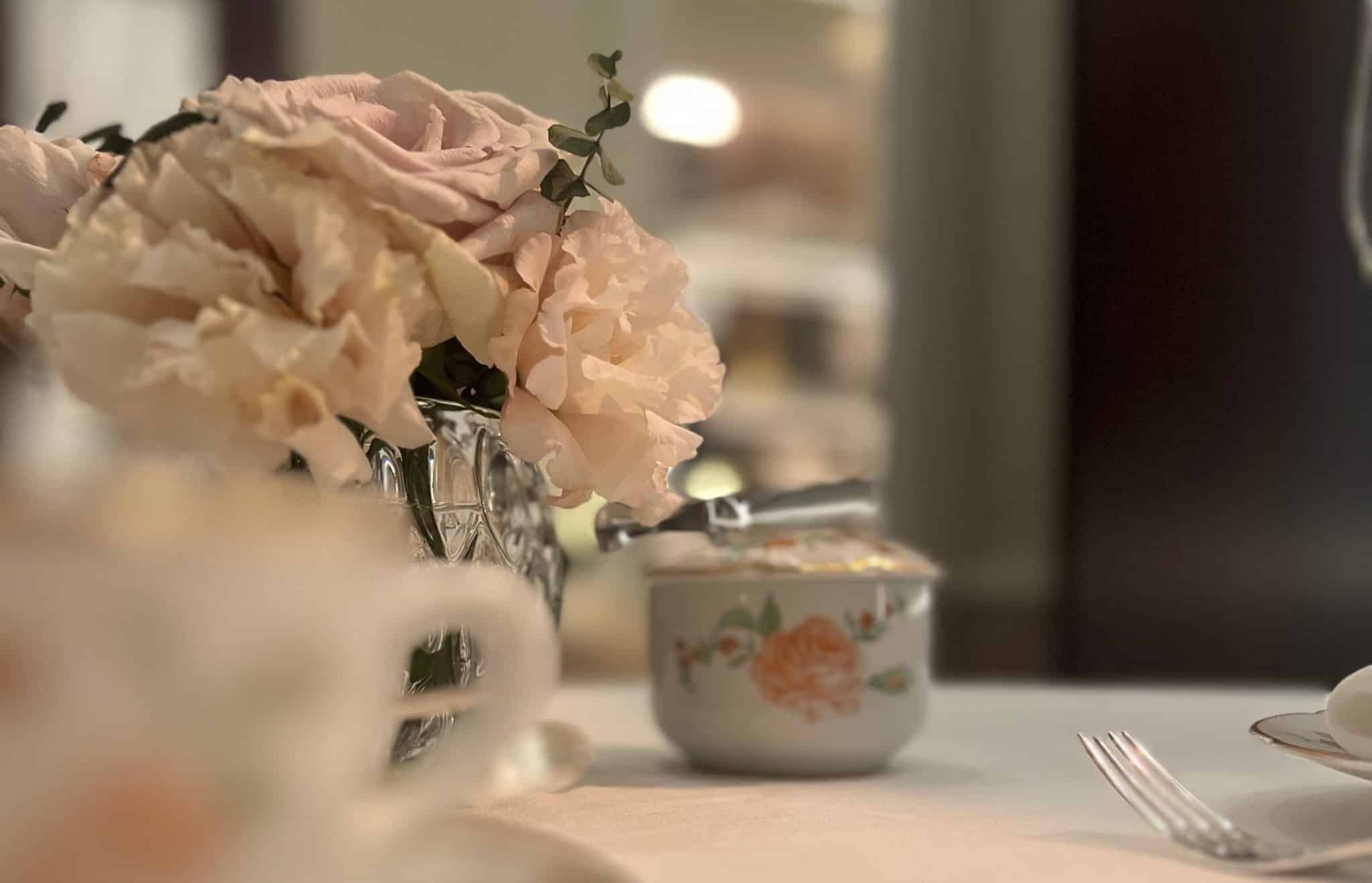A tasteful vase of flowers on a tea table: Quality over volume