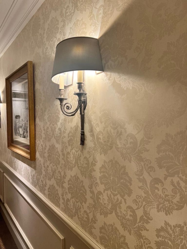 Luxurious sconce on a damask wall: Arrangements beyond the transactional
